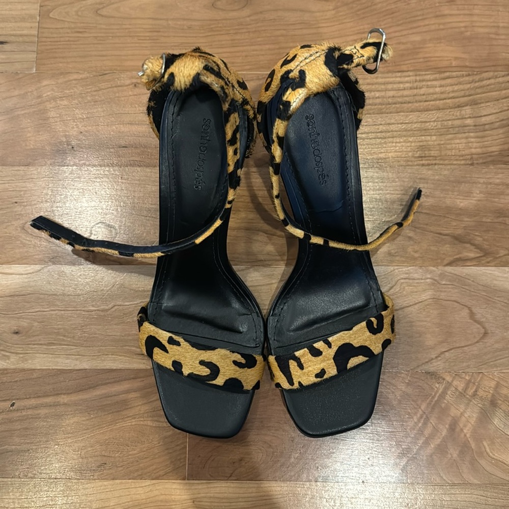 Never worn leopard heeled sandals.